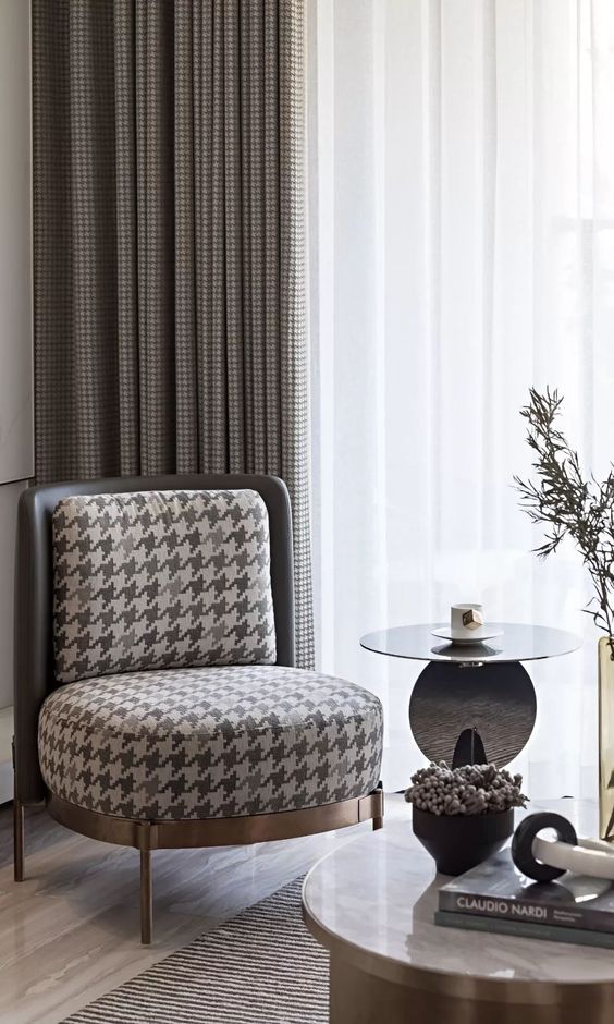 Houndstooth curtains behind chair