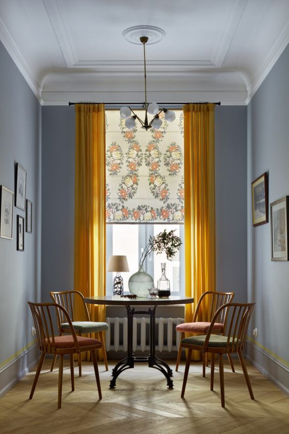 Dining room roman shades layered with curtians