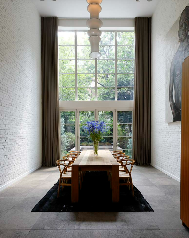 Floor to ceiling curtains in dining room