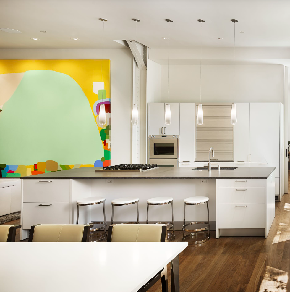 Colorful Wall Art in All-White Kitchen